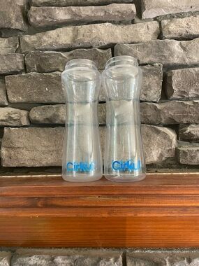 Cirkul Reusable Water Bottles - Clear with Blue Logo (Set of 2) 1 is a cloudy
